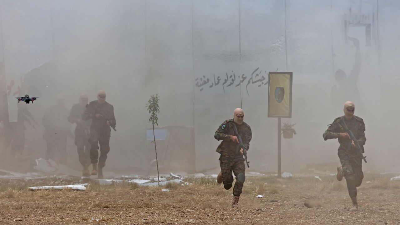 Lebanese Hezbollah fighters took part in cross-border raids, part of large-scale military exercise, in Aaramta bordering Israel in May