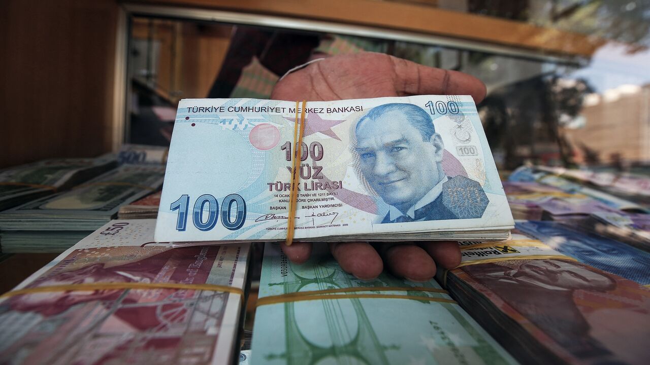 One-hundred Turkish lira notes on display at a currency exchange in Kuwait City, August 12, 2018.