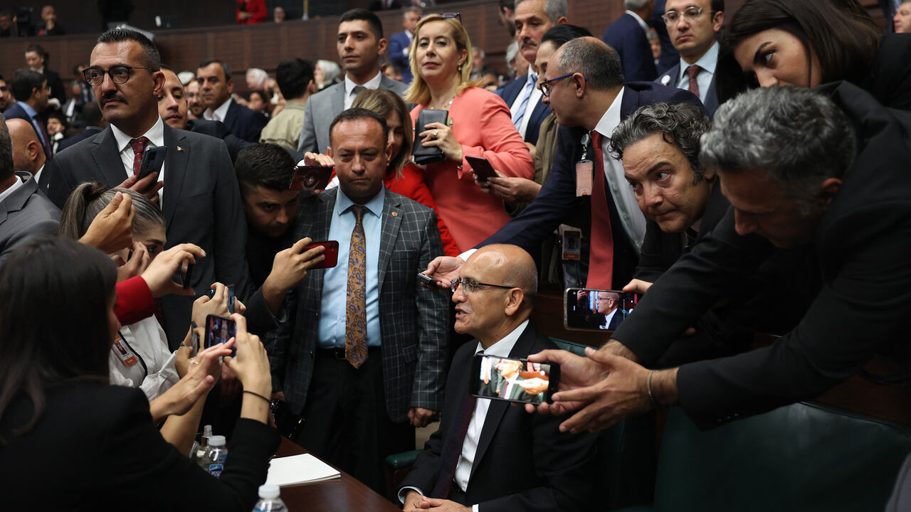 Turkish Treasury and Finance Minister Mehmet Simsek (C) addresses a statement to the journalists at the party's group meeting at the Turkish Grand National Assembly (TBMM) on June 21, 2023. (Photo by Adem ALTAN / AFP) (Photo by ADEM ALTAN/AFP via Getty Images)