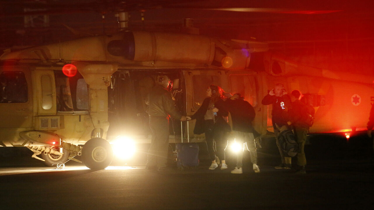 TEL AVIV, ISRAEL - NOVEMBER 28: (EDITOR'S NOTE: Best image available) Families of the hostages arrive, ahead of the expected arrival of hostages who were released today by Hamas, at the Sheba Medical Center in Ramat Gan, Israel. Israel and Hamas agreed to a two-day extension to their initial four-day truce, which promised the release of more Israeli hostages held in Gaza, as well as the release of Palestinian prisoners held in Israeli jails. (Photo by Amir Levy/Getty Images)