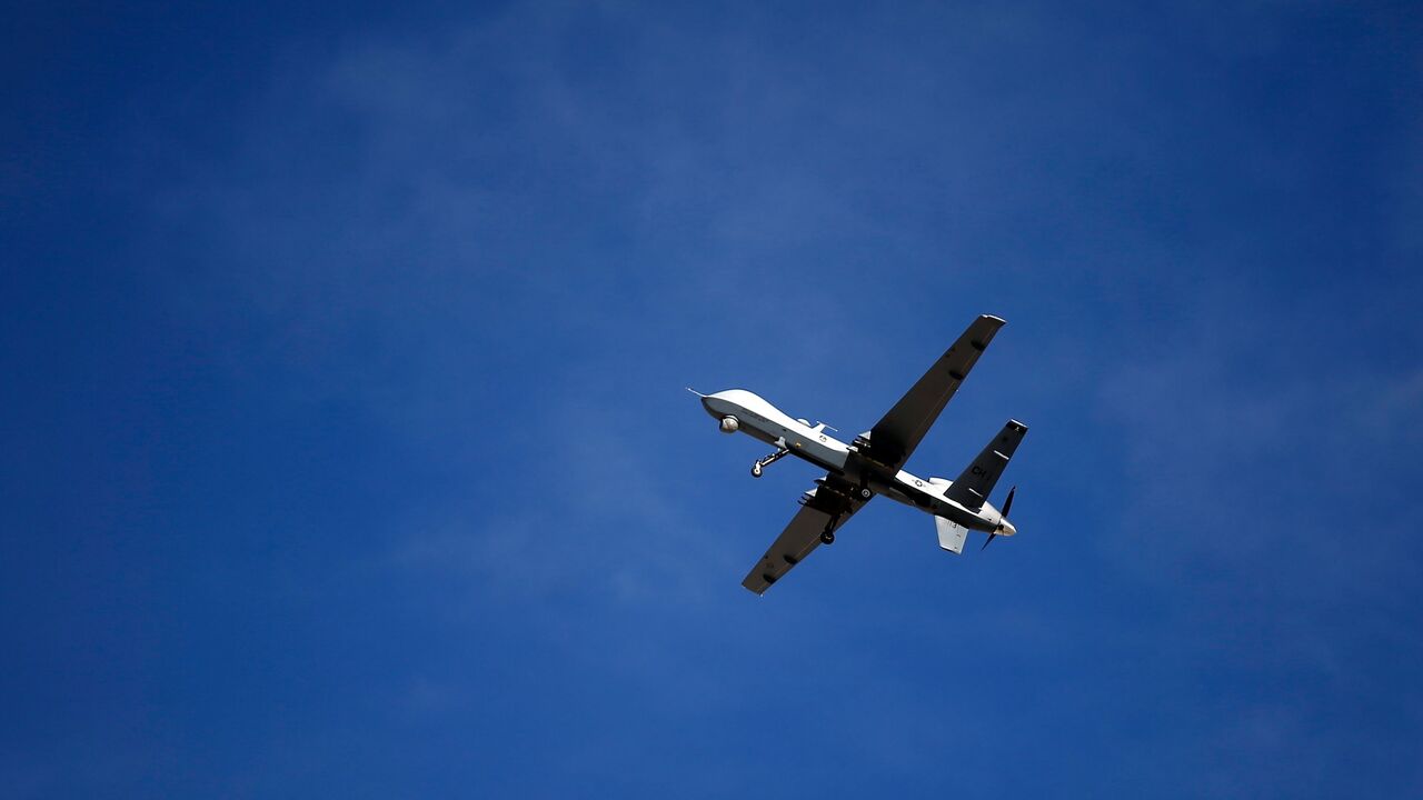 An MQ-9 Reaper remotely piloted aircraft (RPA) flies by at Creech Air Force Base, Indian Springs, Nevada, Nov. 17, 2015.