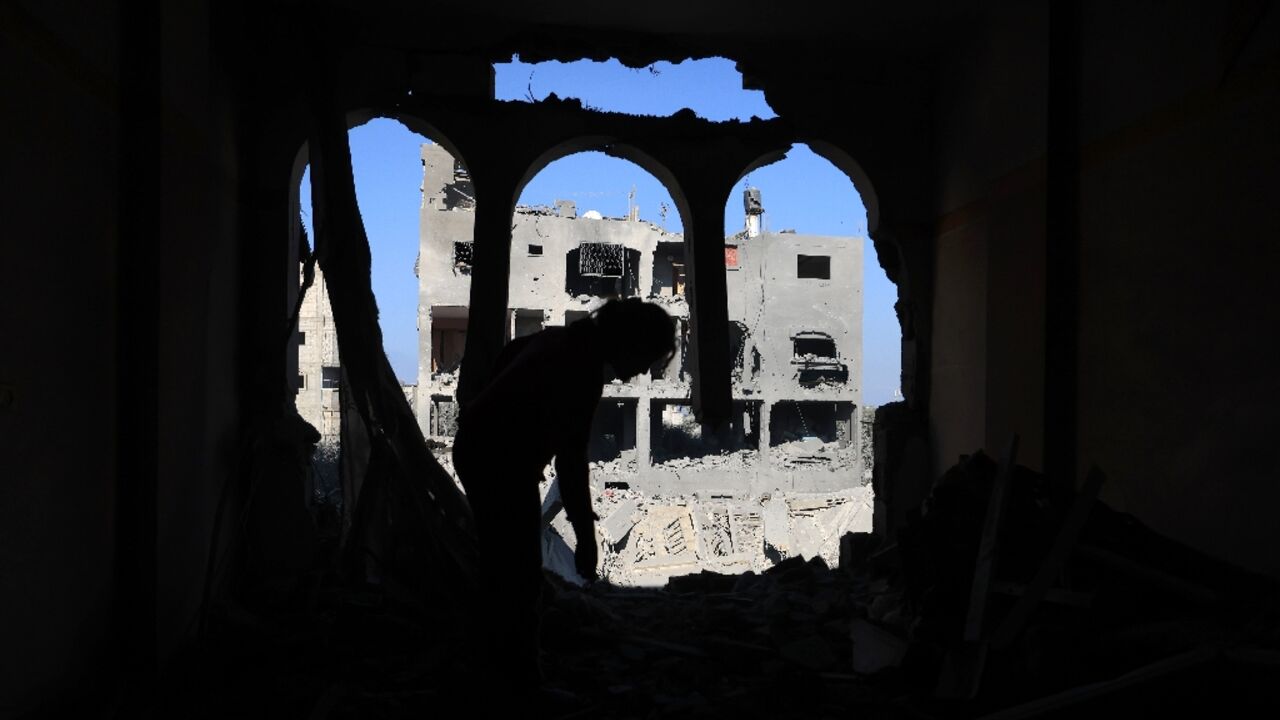 A child inspects the damage at the Nuseirat refugee camp in the central Gaza Strip A child inspects the damage at the Nuseirat refugee camp in the central Gaza Strip