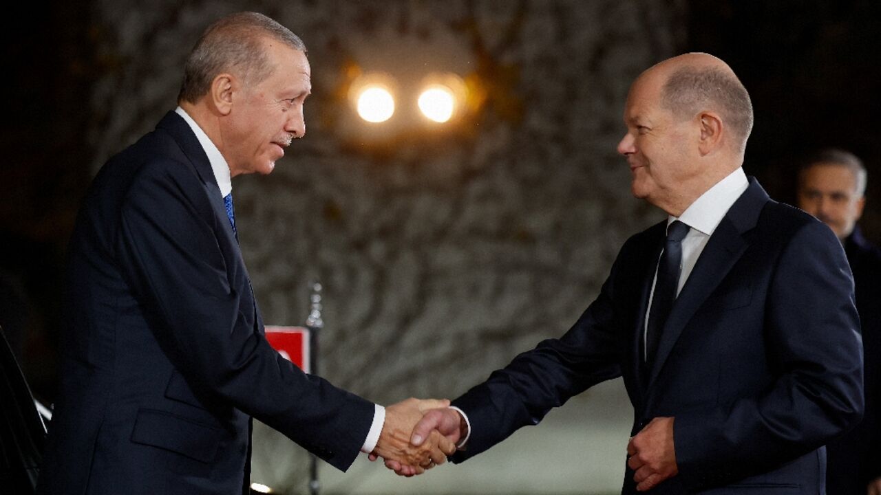 President Recep Tayyip Erdogan, left, and Olaf Scholz acknowledged their divergent views on the Gaza fighting President Recep Tayyip Erdogan, left, and Olaf Scholz acknowledged their divergent views on the Gaza fighting