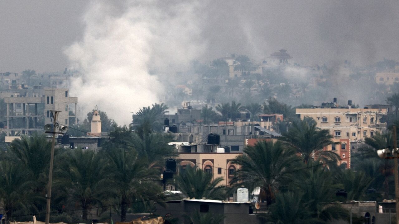 Smoke rises above Khan Yunis in southern Gaza as Israeli troops engage in ground combat in the city