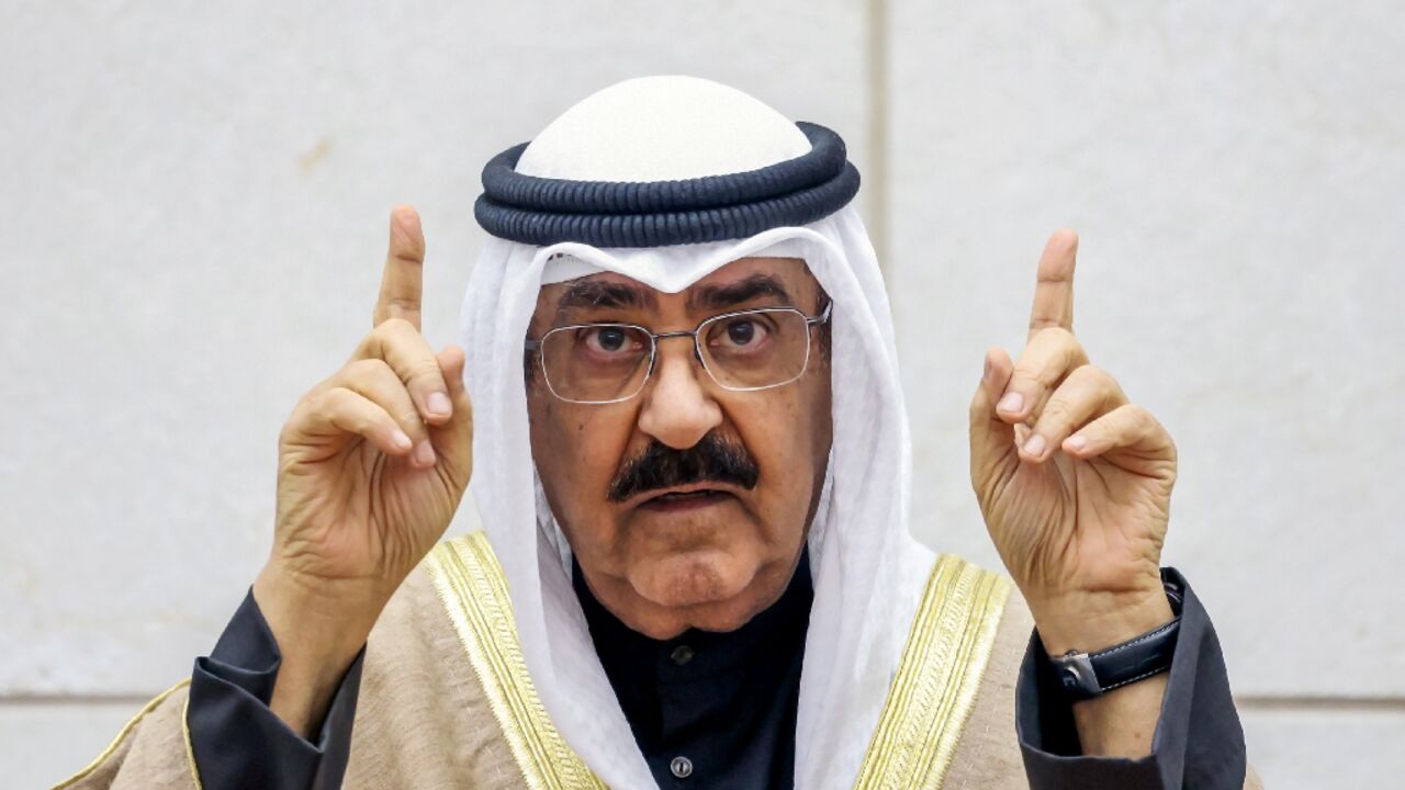 Kuwait's new emir Sheikh Meshal al-Ahmad al-Sabah gestures as he swears in before lawmakers as the country's 17th ruler Kuwait's new emir Sheikh Meshal al-Ahmad al-Sabah gestures as he swears in before lawmakers as the country's 17th ruler