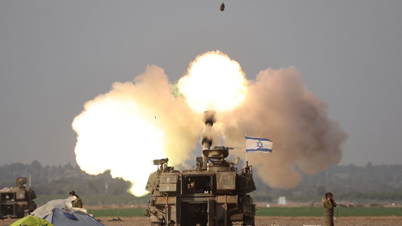 Israeli forces shell Gaza from the border area in southern Israel on December 12