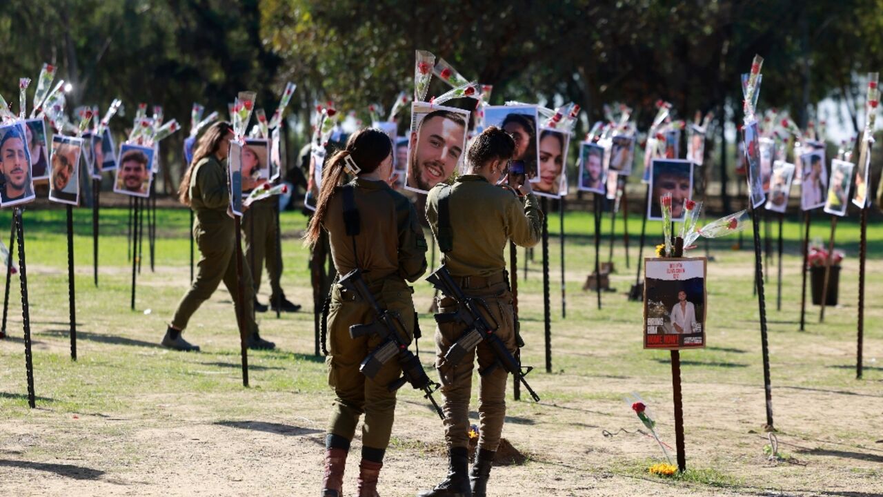 Israeli soldiers pay their respects to those killed or taken hostage by Hamas at the Supernova music festival Israeli soldiers pay their respects to those killed or taken hostage by Hamas at the Supernova music festival