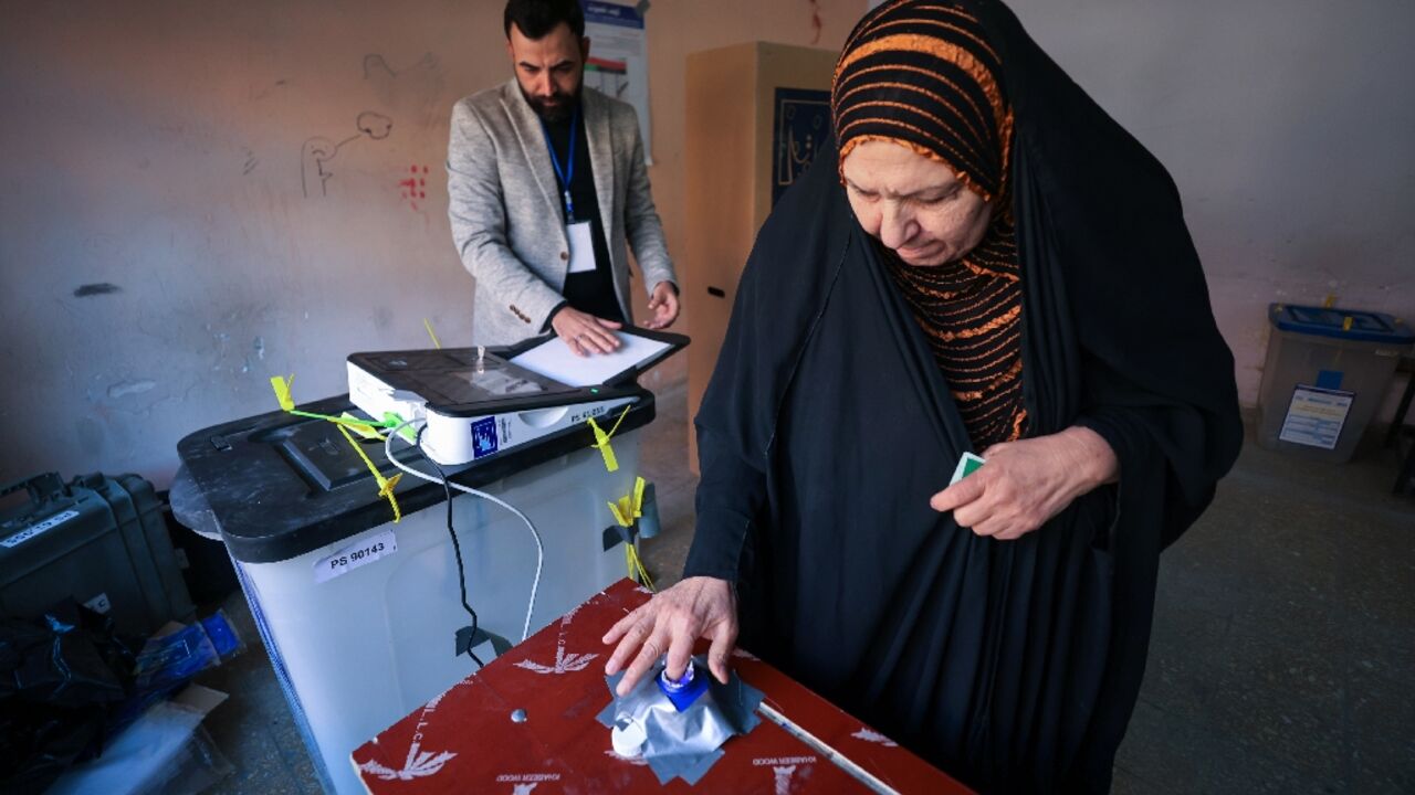 A woman votes in Baghdad in Iraq's first provincial council elections in a decade A woman votes in Baghdad in Iraq's first provincial council elections in a decade