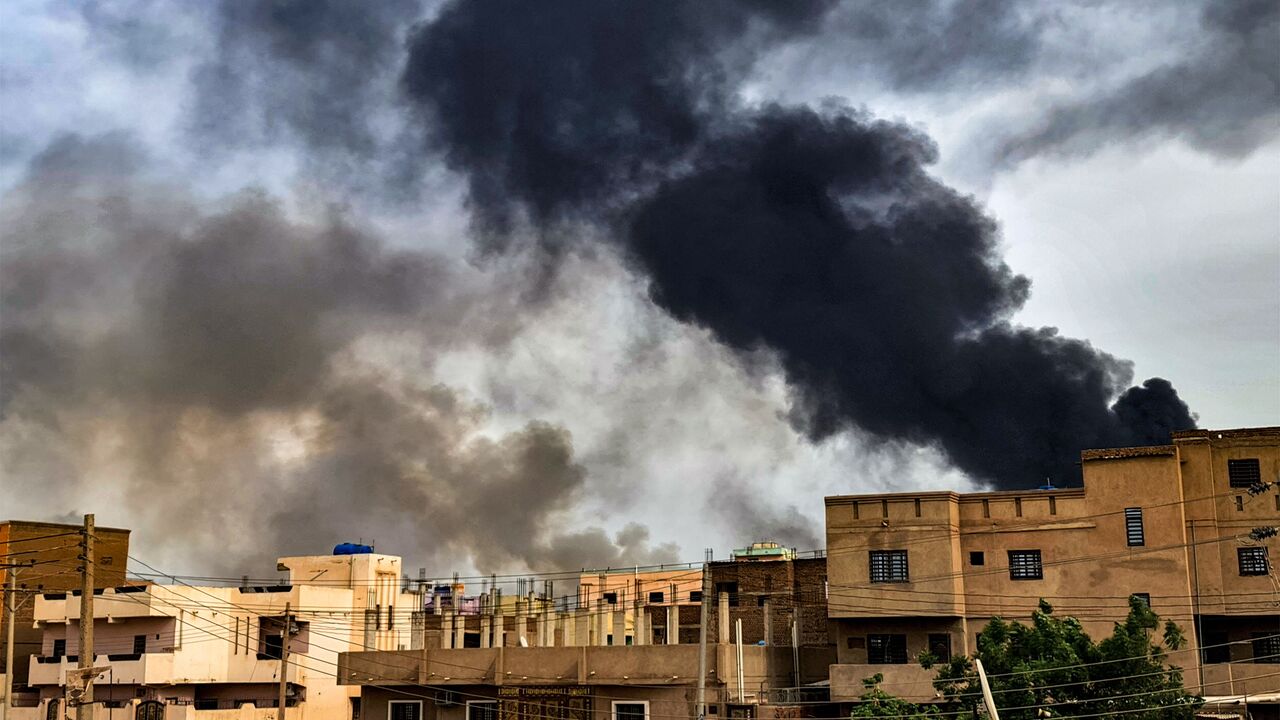 Smoke plumes billow from a fire at a lumber warehouse in southern Khartoum amidst ongoing fighting on June 7, 2023. Eight weeks of fighting have pitted Sudan's army chief Abdel Fattah al-Burhan against his former deputy Mohamed Hamdan Daglo -- commonly known as Hemeti -- who commands the powerful paramilitary Rapid Support Forces (RSF). A number of broken ceasefires have offered brief lulls but no respite for residents of Khartoum, where witnesses again reported "the sound of heavy artillery fire" in the ca