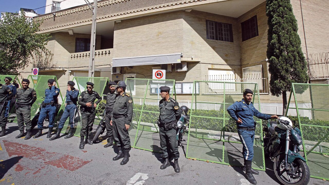 Policemen stand guard outside Sweden's embassy in Tehran on June 30 2023, during a demonstration denouncing the burning of Islam's holy book. 