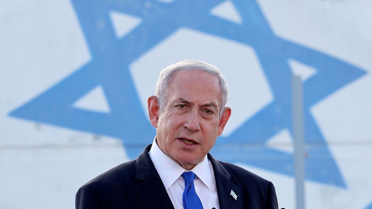 Israel's Prime Minister Benjamin Netanyahu delivers a speech during his visit to an Israeli unmanned aerial vehicle (UAV) centre, at the Palmachim Airbase near the city of Rishon LeZion on July 5, 2023.