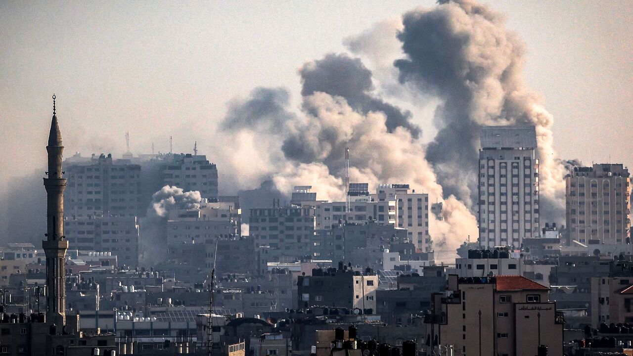 Smoke plumes billow during Israeli air strikes in Gaza City on October 12, 2023 as raging battles between Israel and the Hamas movement continue for the sixth consecutive day. Washington urged Israel to show restraint in its response to Hamas's surprise attack -- the worst in the country's 75-year history -- which Israeli forces said killed more than 1,200 people, mostly civilians. In Gaza, officials have reported more than 1,200 people killed in Israel's uninterrupted campaign of air and artillery strikes,