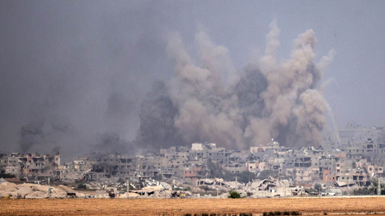 A picture taken from southern Israel near the border with the Gaza Strip on Dec. 10, 2023, shows smoke rising above the northern part of the Palestinian enclave amid ongoing battles between Israel and the Palestinian Hamas movement.