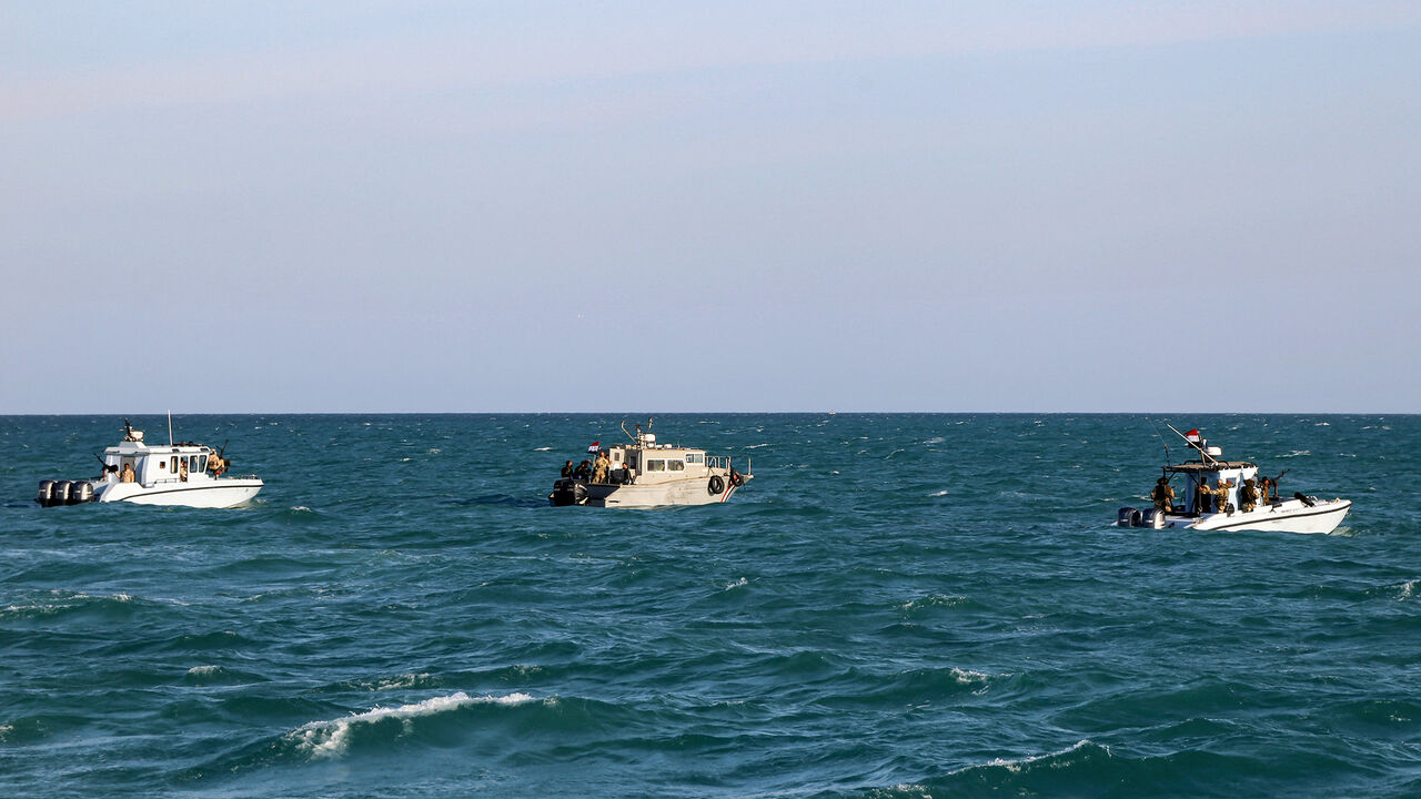 Yemeni coastguard members loyal to the internationally-recognised government ride in boats in the Red Sea off of the government-held town of Mokha in the western Taiz province, close to the strategic Bab al-Mandab Strait, on December 12, 2023. (Photo by Khaled Ziad / AFP) (Photo by KHALED ZIAD/AFP via Getty Images)