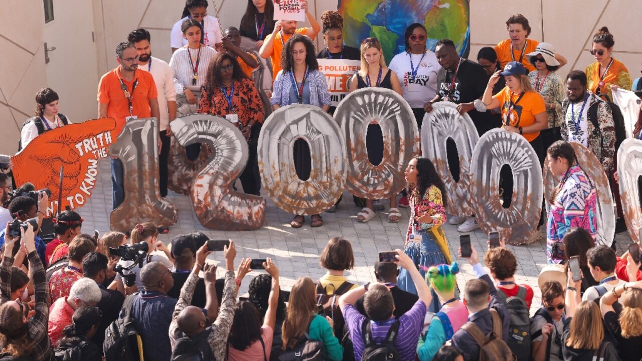 Activists protest about presence of fossil fuel lobbyists at COP28