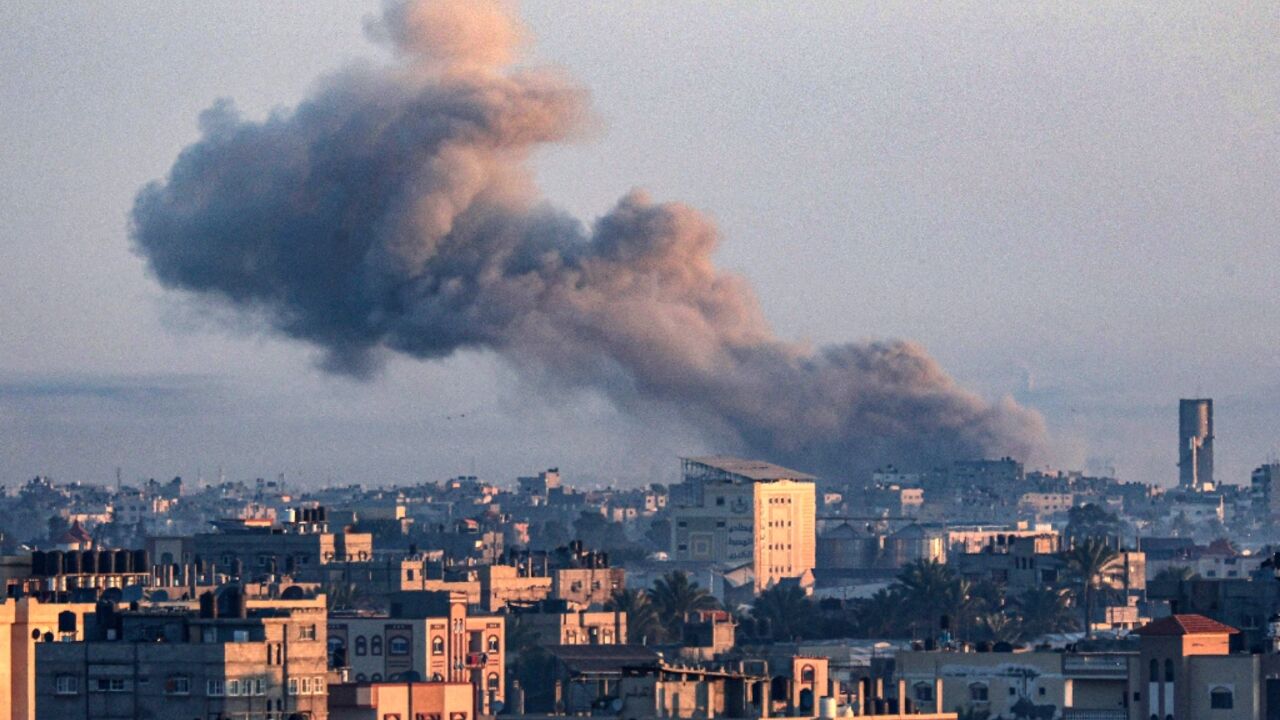 Smoke billows over the southern Gaza Strip on Saturday amid ongoing battles between Israel and the militant group Hamas