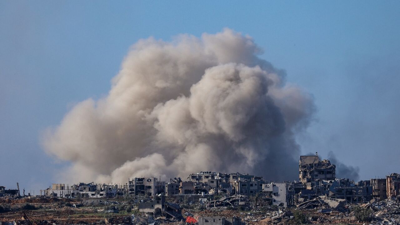 A picture taken from southern Israel on the border with the Gaza Strip shows smoke billowing over northern Gaza on December 16, 2023