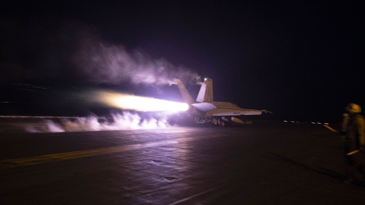 A photo released by the US Navy shows a warplane on the deck of the USS Dwight D. Eisenhower aircraft carrier -- which has taken part in operations against Yemen's Huthis -- on January 22, 2024 A photo released by the US Navy shows a warplane on the deck of the USS Dwight D. Eisenhower aircraft carrier -- which has taken part in operations against Yemen's Huthis -- on January 22, 2024