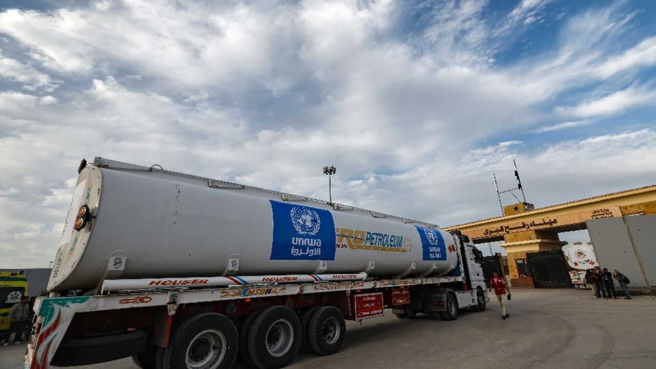 A truck from the United Nations agency for Palestinian refugees (UNRWA) carrying fuel arrives at the Egyptian side of the Rafah border crossing with Gaza on November 22, 2023, during fighting between Israel and Hamas militants