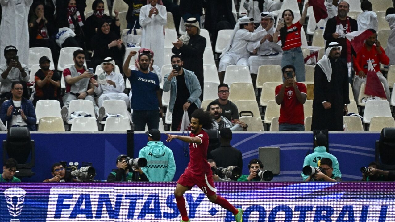 Qatar's forward Akram Afif celebrates after scoring his team's third 