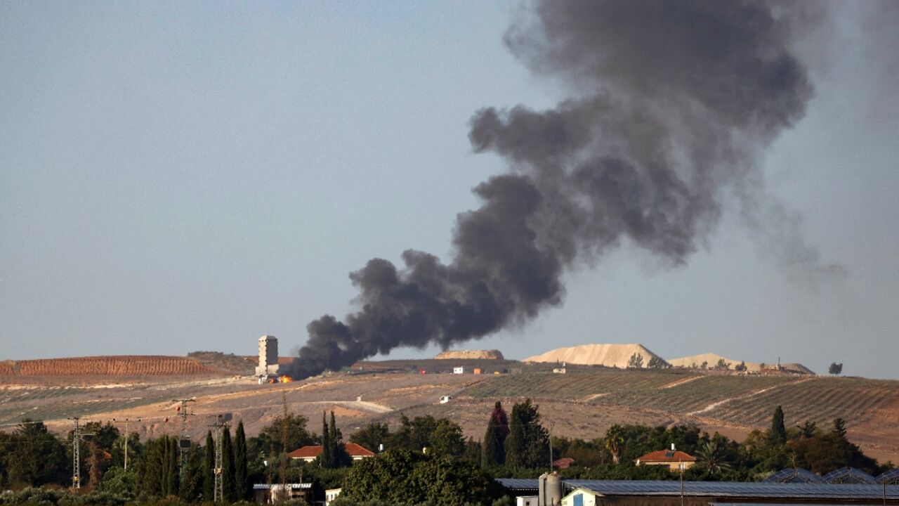 Flames and smoke rise over the Lebanese village of Khiam following Israeli bombardment Flames and smoke rise over the Lebanese village of Khiam following Israeli bombardment
