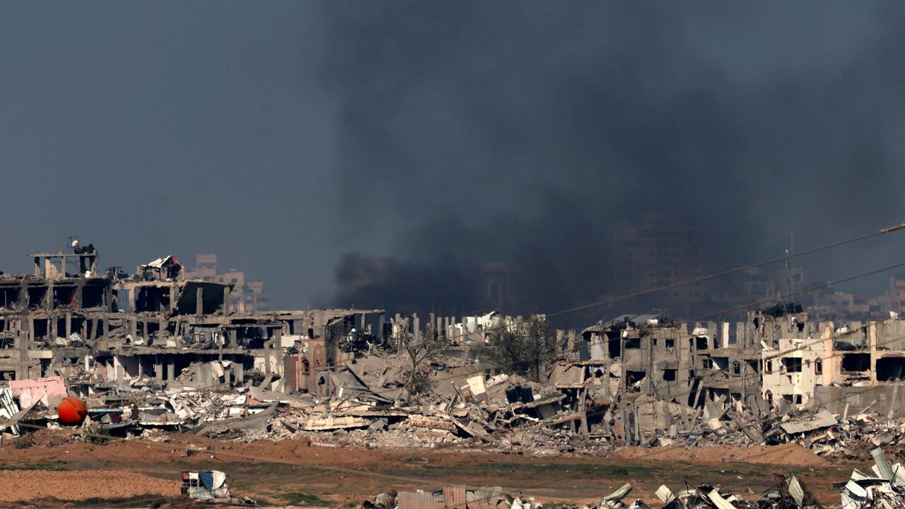 This picture taken from the Israeli border with the Gaza Strip shows smoke billowing over Gaza City following Israeli strikes on Jan. 1, 2024, amid the ongoing battles between Israel and the militant Hamas group.