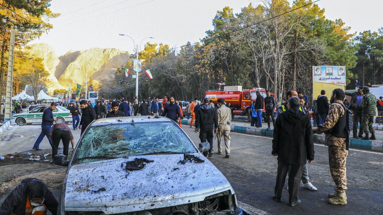 This picture shows people and Iranian emergency personnel at the site where two explosions in quick succession struck a crowd marking the anniversary of the 2020 killing of Guards general Qasem Soleimani, near the Saheb al-Zaman Mosque in the southern Iranian city of Kerman on Jan. 3, 2024.