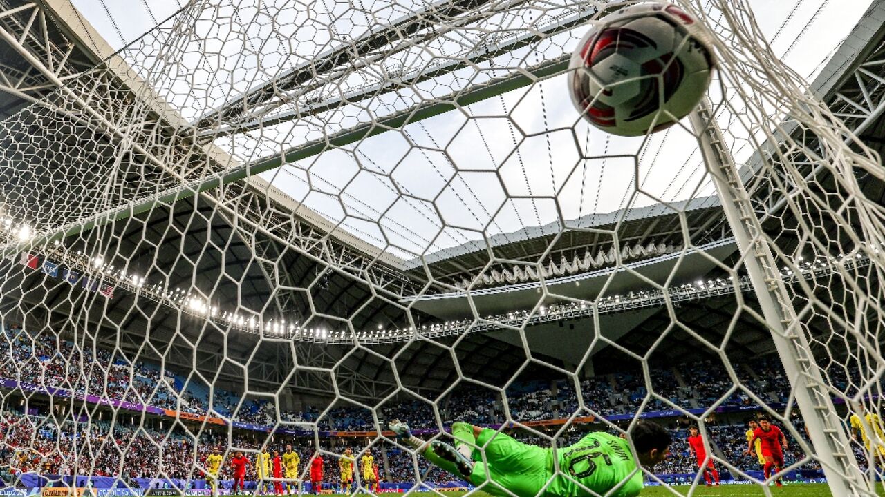 Malaysia's goalkeeper Syihan Hazmi is beaten by Son Heung-min's penalty Malaysia's goalkeeper Syihan Hazmi is beaten by Son Heung-min's penalty