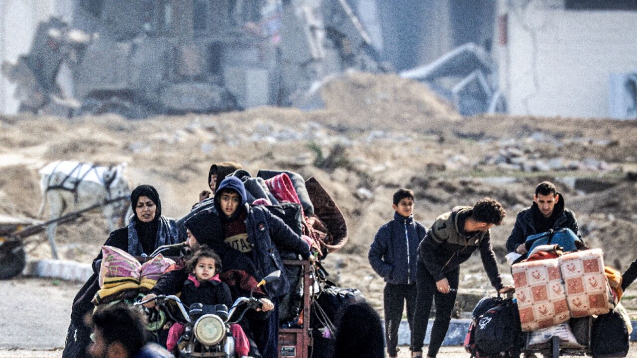 Displaced Palestinians flee from Khan Yunis in the southern Gaza Strip on January 30, 2024, amid the ongoing conflict between Israel and Hamas Displaced Palestinians flee from Khan Yunis in the southern Gaza Strip on January 30, 2024, amid the ongoing conflict between Israel and Hamas