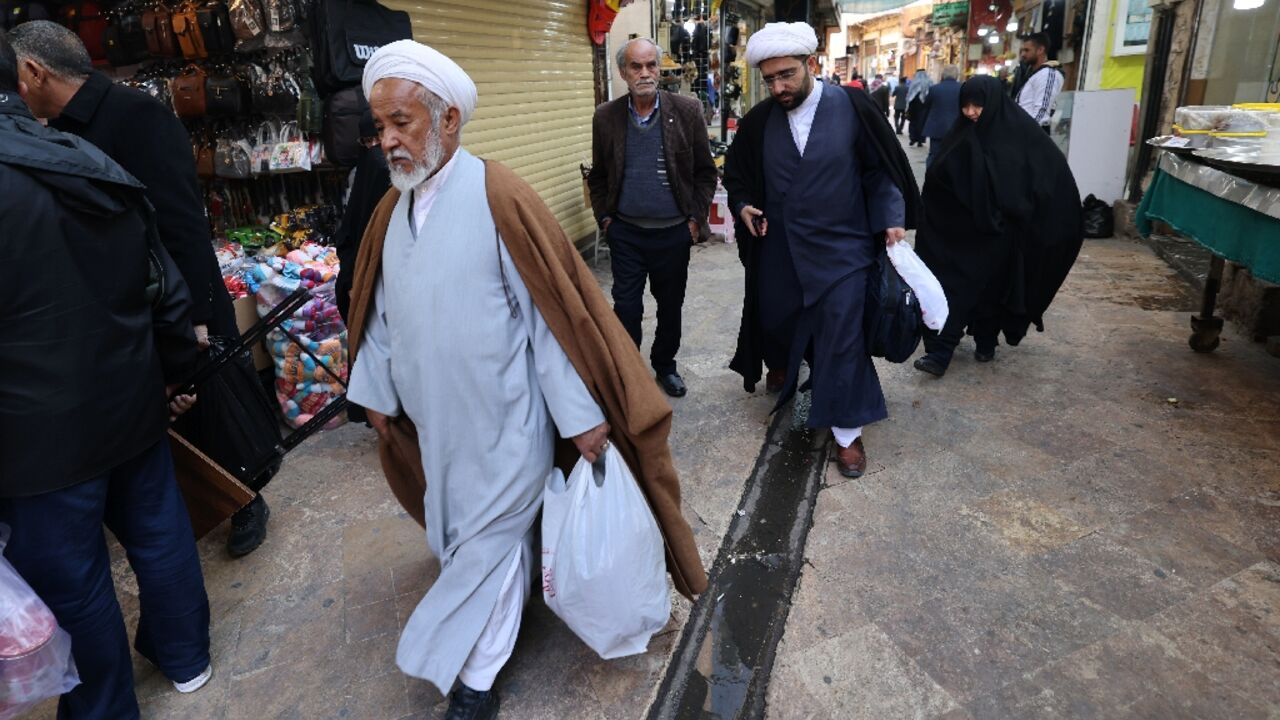 Across Iran, the economic pain has fuelled political malaise, with a poll finding many don't intend to vote Across Iran, the economic pain has fuelled political malaise, with a poll finding many don't intend to vote