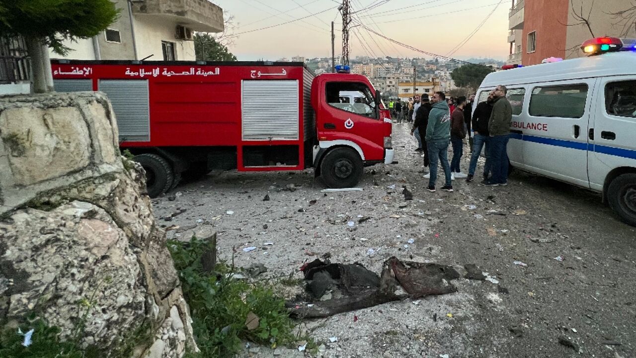 Lebanese emergency services respond to an Israeli drone strike which killed two Hezbollah fighters in the southern village of Kfar Rumman, according to a security source Lebanese emergency services respond to an Israeli drone strike which killed two Hezbollah fighters in the southern village of Kfar Rumman, according to a security source
