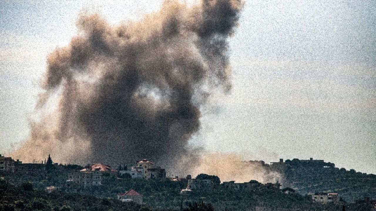 Smoke billows over the south Lebanon village of Kfarkila following an Israeli bombardment in the latest exchange of fire across the border