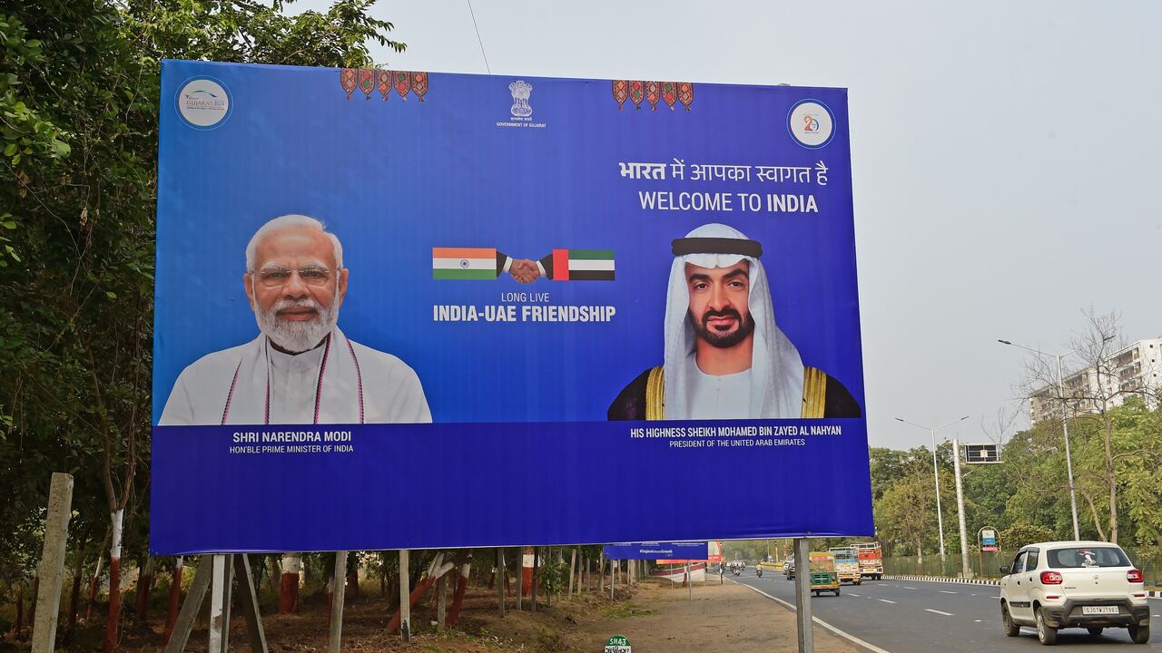 A billboard with pictures of Indian Prime Minister Narendra Modi (L) and President of the United Arab Emirates (UAE) Sheikh Mohammed bin Zayed Al Nahyan.