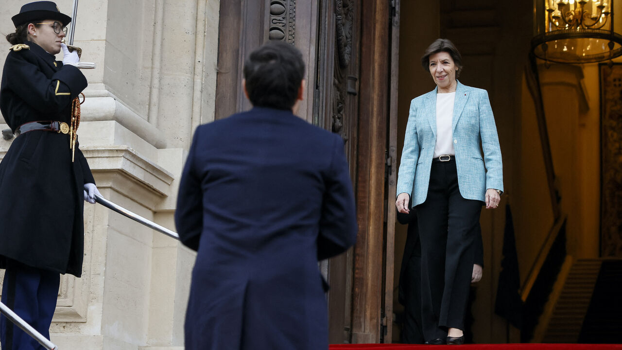 Outgoing French Foreign Minister Catherine Colonna (R) welcomes newly appointed Foreign Minister Stephane Sejourne at the ministry before the handover ceremony in Paris, on Jan. 12, 2024.  