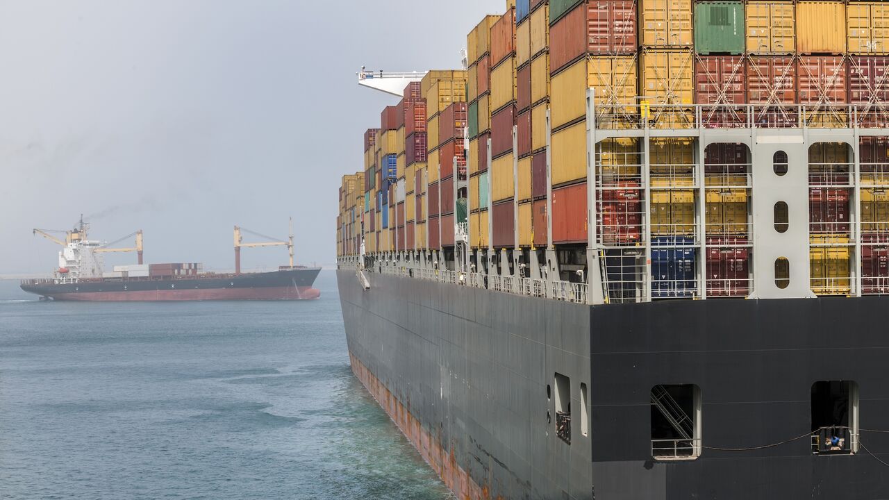 Container ships moving on Suez Canal.