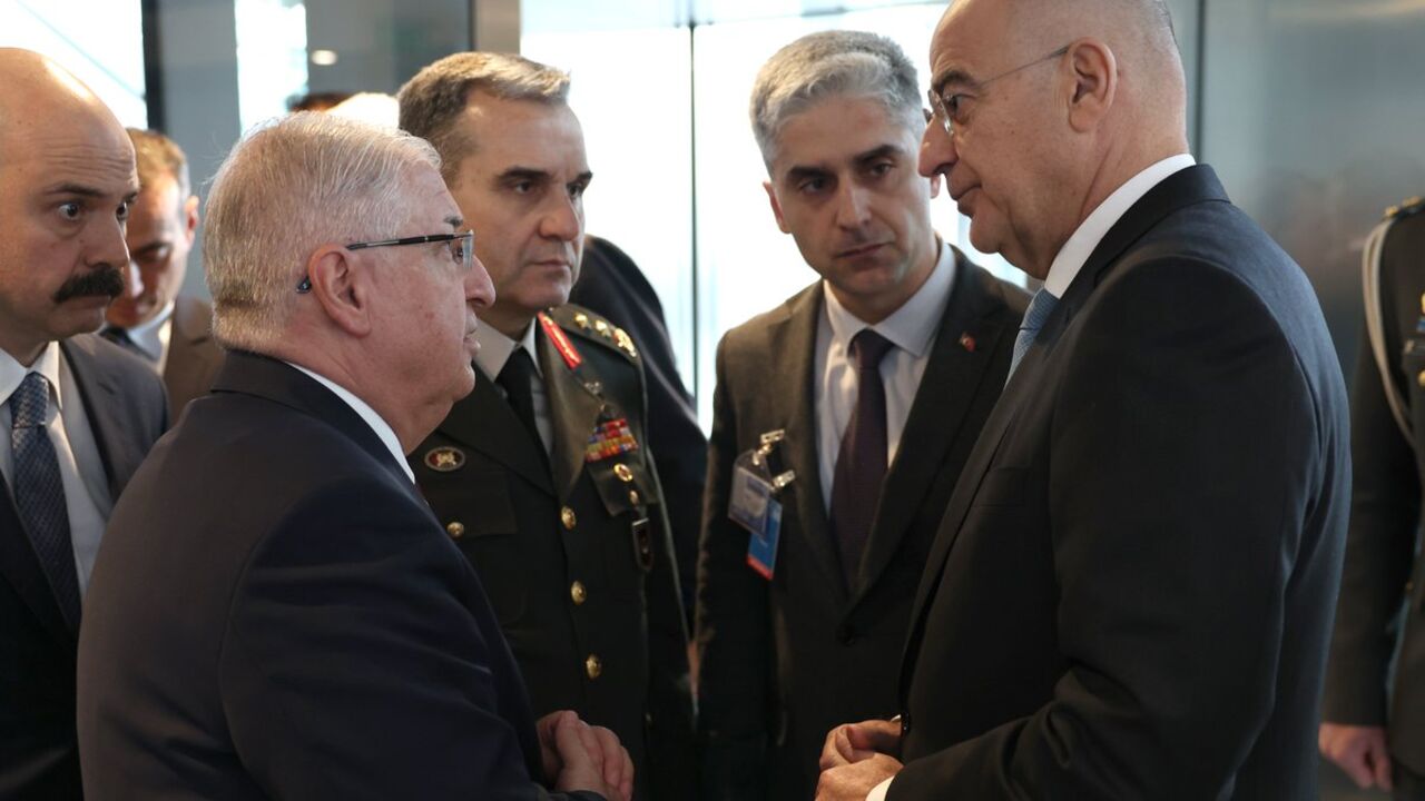 Turkish Defense Minister Yaşar Güler and his Greek counterpart, Nikos Dendias, on the sidelines of a NATO summit in Brussels Feb. 15, 2024.