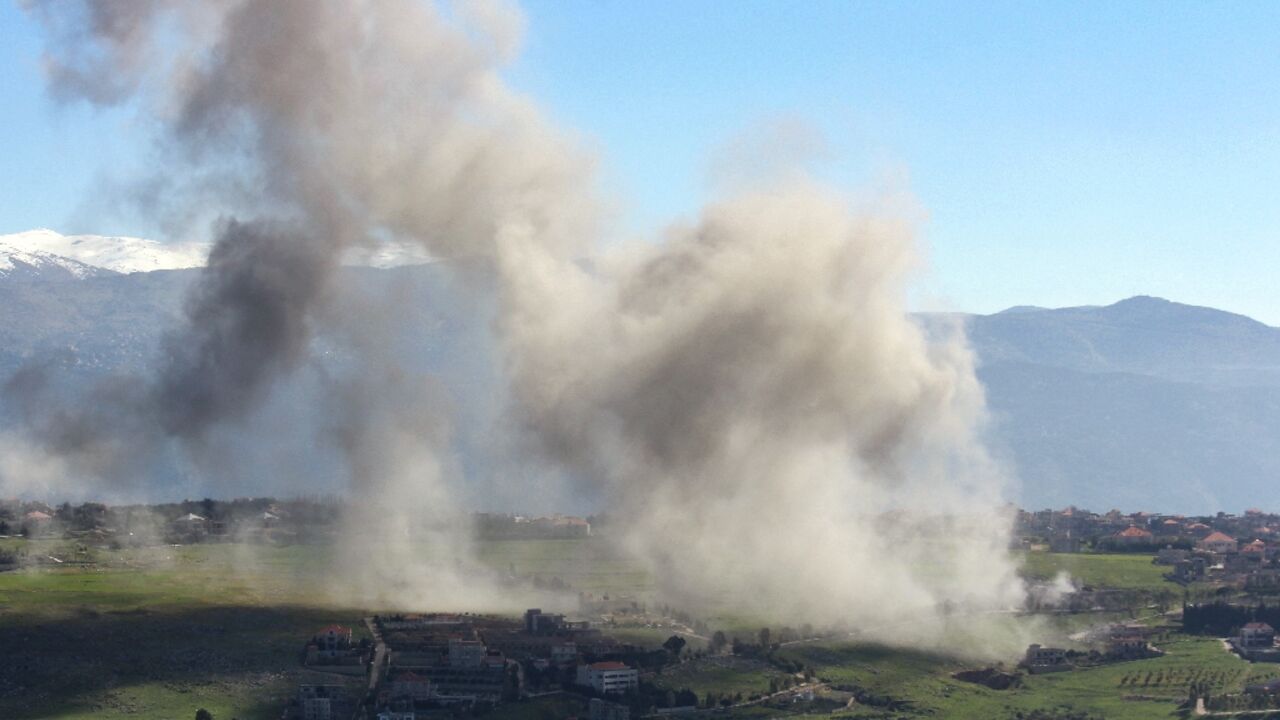 Smoke billows over the south Lebanon village of Khiam after an Israeli air strike