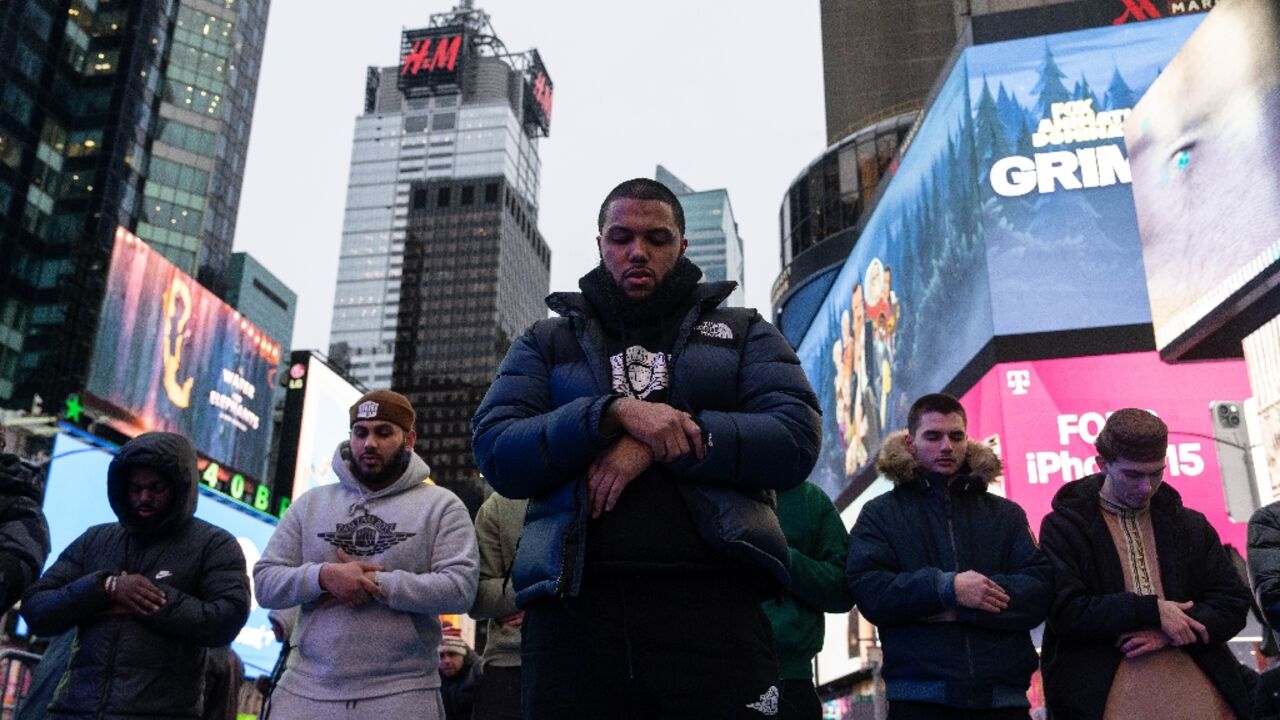 Worshippers performed Taraweeh, special Ramadan night prayers, against the backdrop of the bright LED advertising billboards Worshippers performed Taraweeh, special Ramadan night prayers, against the backdrop of the bright LED advertising billboards