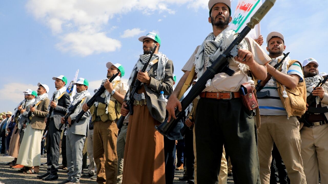 Yemenis take part in a parade in the Huthi-run capital Sanaa on March 9