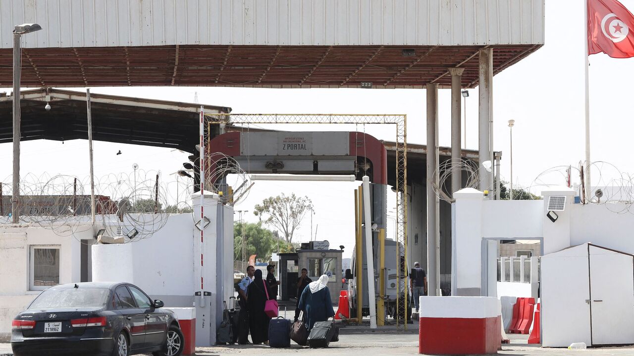 A picture taken on Sept. 17, 2021, shows people queuing to cross into Tunisia through the Libyan Ras Jdeir border crossing.