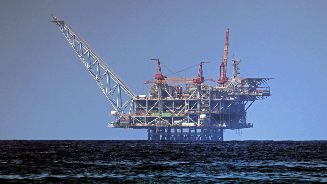A view of the platform of the Leviathan natural gas field in the Mediterranean Sea is pictured from the Israeli northern coastal beach of Nasholim, on Aug. 29, 2022.