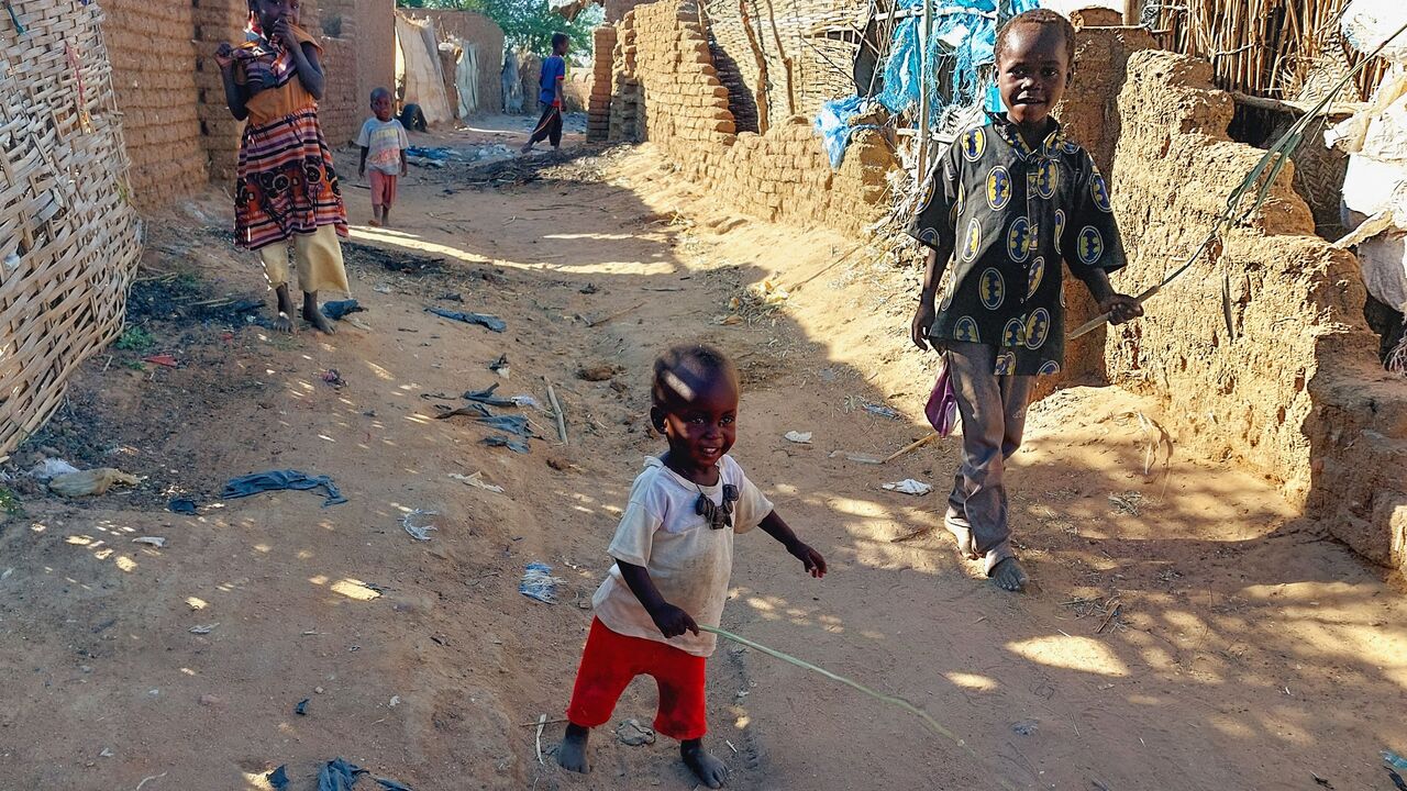 Children are pictured at the Kalma camp for the displaced just outside Nyala, the provincial capital of South Darfur state, on November 20, 2022. - Sudan is one of the world's poorest countries, with one third of the population, at least 15 million people, facing a growing hunger crisis, according to United Nations figures. (Photo by Abdelmonim MADIBU / AFP) (Photo by ABDELMONIM MADIBU/AFP via Getty Images)