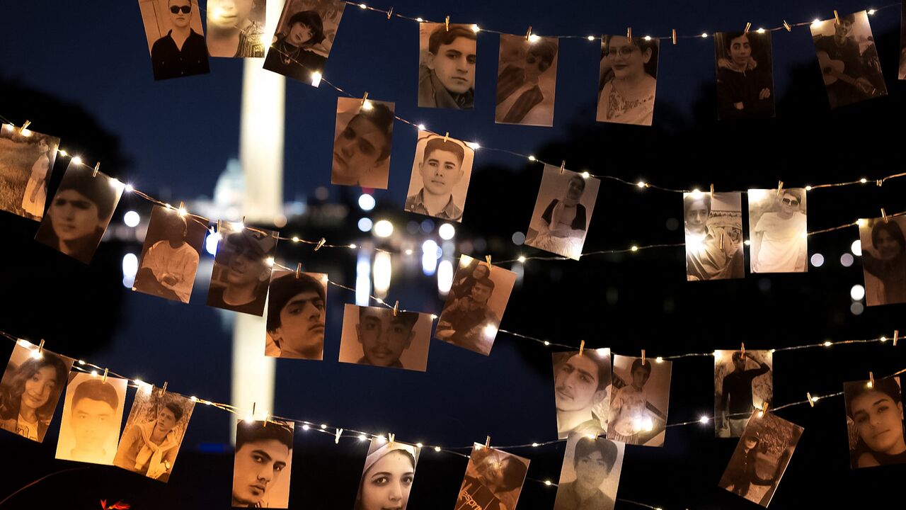 A display of photos of protesters killed during a candlelight vigil on the first anniversary of Mahsa Amini's death in Iranian custody, Washington, DC, Sept. 16, 2023