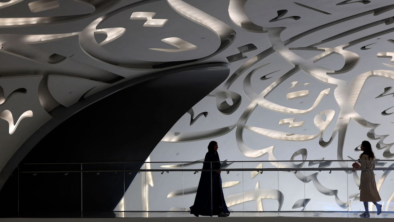 Women walks through the Museum of the Future in Dubai during the Artificial Intelligence Forum held on October 11, 2023. (Photo by Karim SAHIB / AFP) (Photo by KARIM SAHIB/AFP via Getty Images)