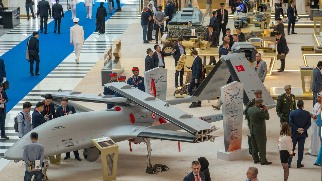 Visitors view a Bayraktar TB3 Armed Unmanned Aerial System on display at the UMEX Exhibition showcasing drones, robotics, and unmanned sytems at the Abu Dhabi National Exhibition Centre in Abu Dhabi on January 23, 2024. (Photo by Ryan LIM / AFP) (Photo by RYAN LIM/AFP via Getty Images)