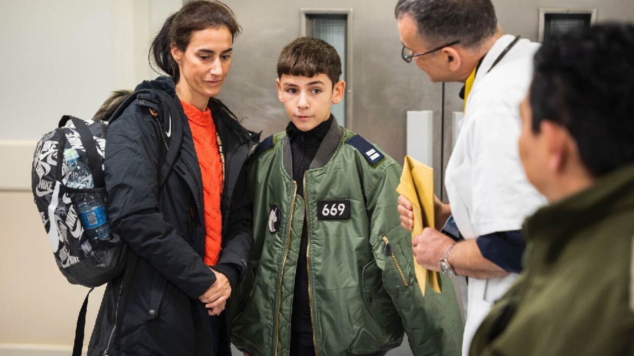 Eitan Yahalomi (R) was reunited with his mother after 52 days in captivity Eitan Yahalomi (R) was reunited with his mother after 52 days in captivity