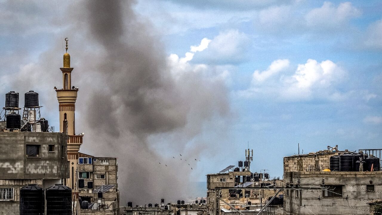 A smoke plume erupts during Israeli bombardment in Rafah, the southern Gaza Strip, where world leaders have warned against an Israeli ground operation 