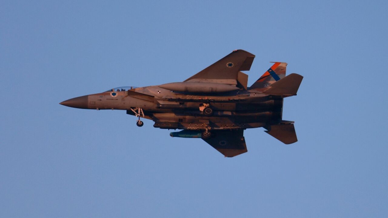 An Israeli army F-15 fighter jet flies over central Israel