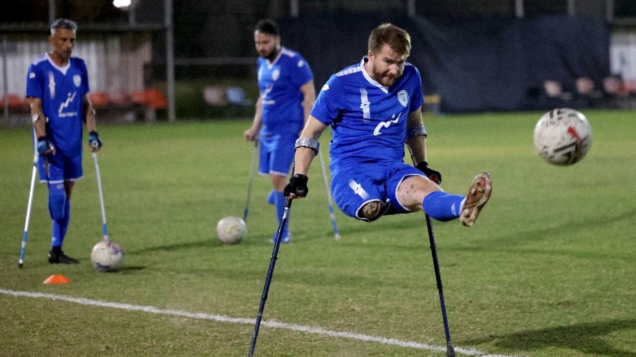 Ben Binyamin 29, shoots at goal during training with the Israeli amputee football team Ben Binyamin 29, shoots at goal during training with the Israeli amputee football team