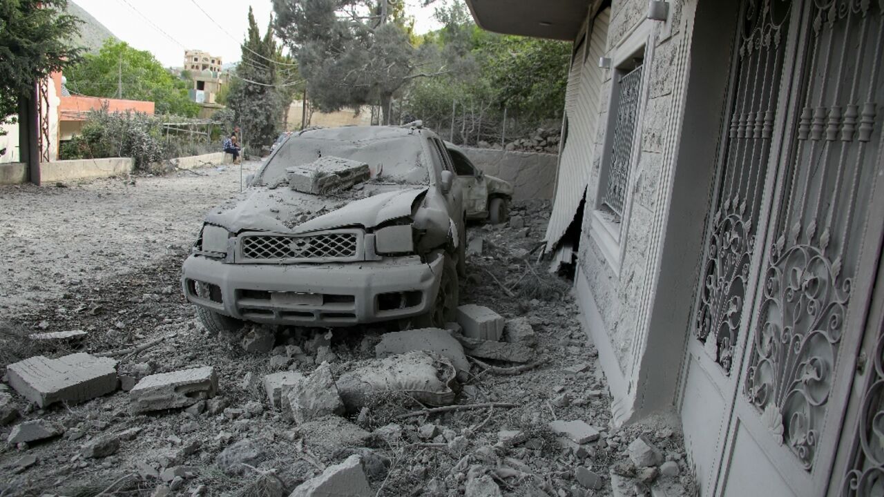 Rubble litters the area around a house hit by an Israeli air strike in the southern Lebanese village of Shebaa 